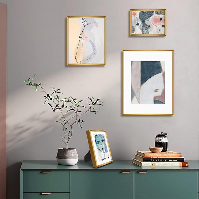 Frametory, Bronze Aluminum Picture Frame with Removable Mat - Set of 7 Includes Four 5x7, Two 8x10, One 11x14 - Real Glass Front - Simple Gallery Wall Frames for Art Prints and Posters