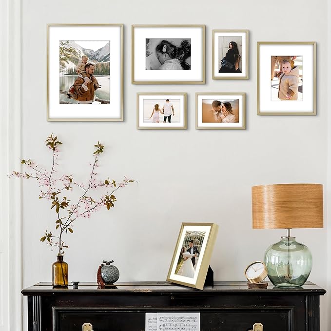 Frametory, Aluminum Picture Frames Set of 7 - Gold Gallery Wall Kit - Displays One 11x14, Two 8x10, and Four 5x7 inch Photos for Home Decoration